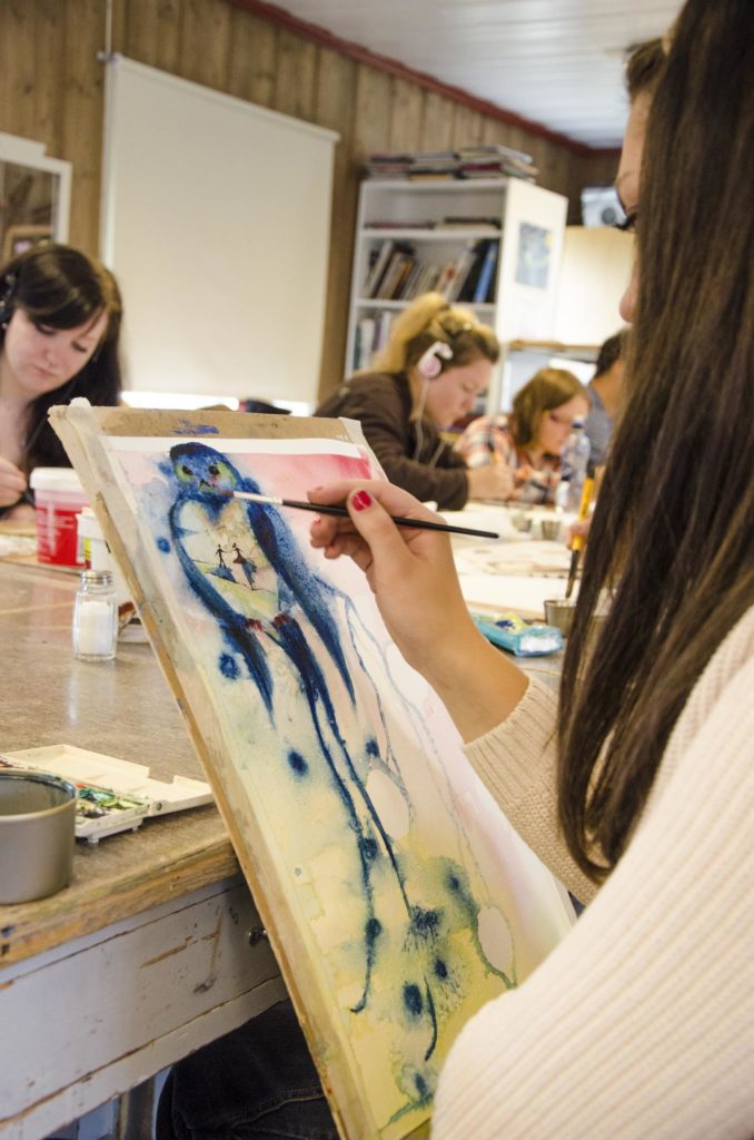 Girl paints watercolor