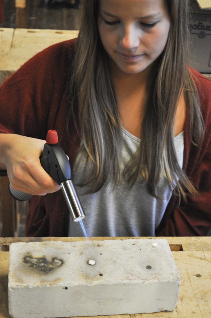 Girl melts jewelry with heat gun