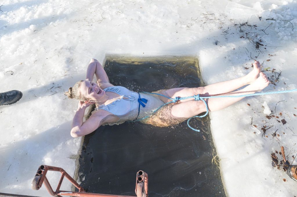 Young woman relaxing and ice bathing
