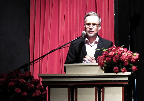 Man on lectern