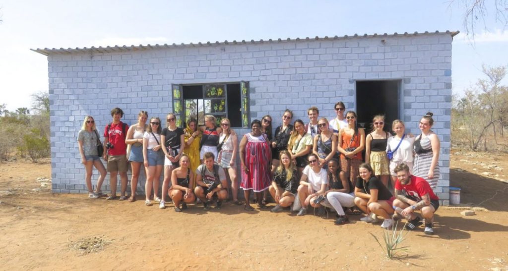 Group of young people with the San people in Namibia